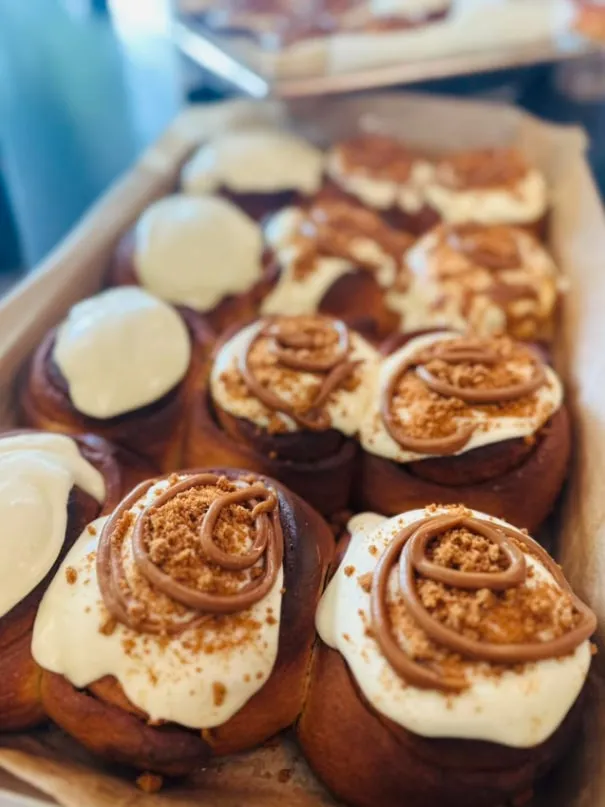 Cinnamon scrolls topped with cream cheese icing and Biscoff