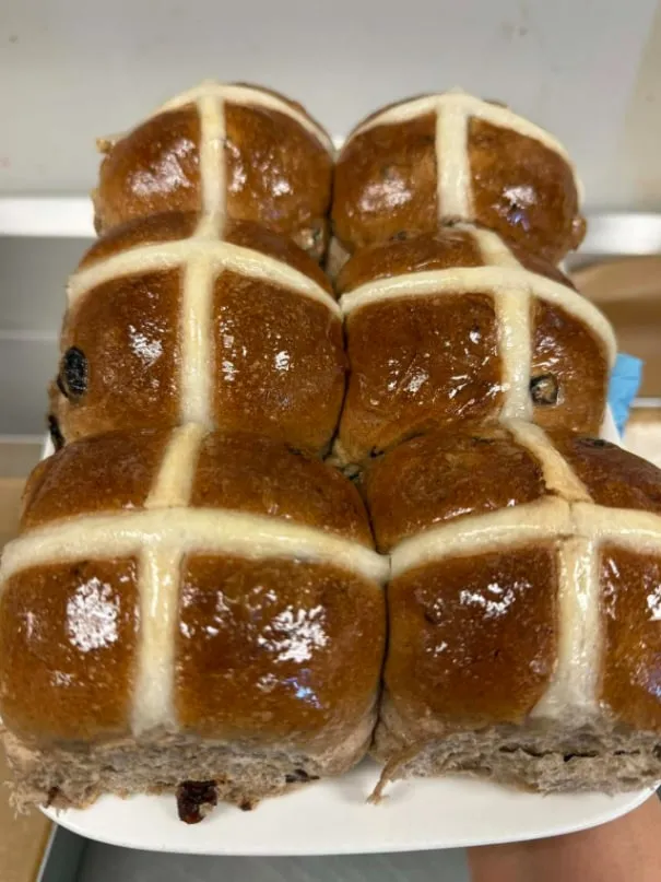 Tray of glossy hot cross buns