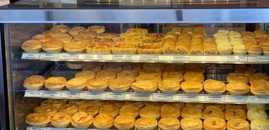 The pie cabinet full of pies, quiches and savouries