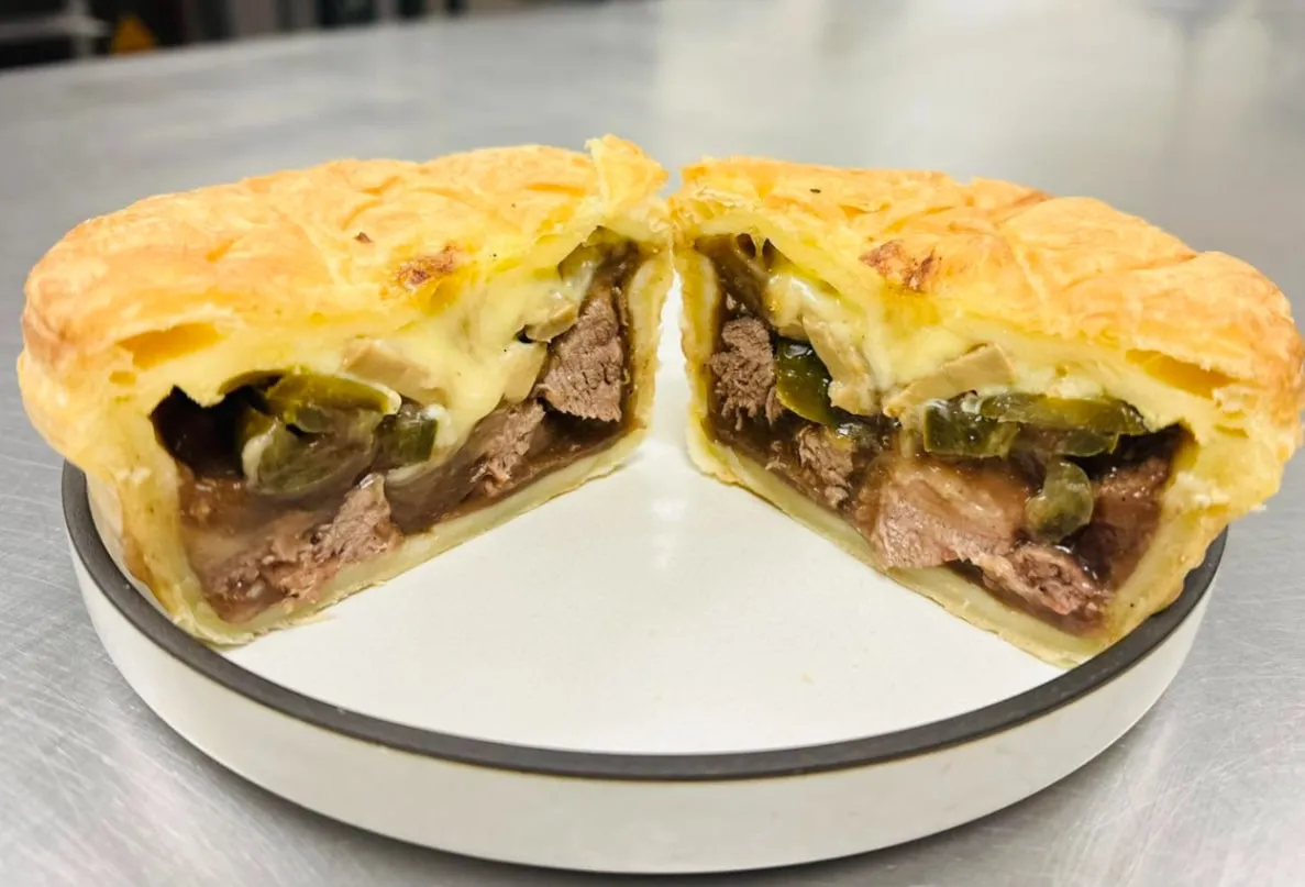 Steak, cheese and jalapeño pie cut in half